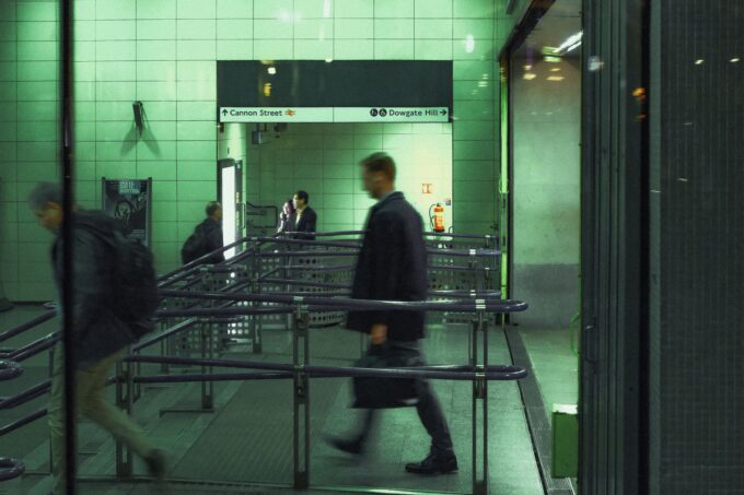 Commuters moving through Cannon Street Underground station in London