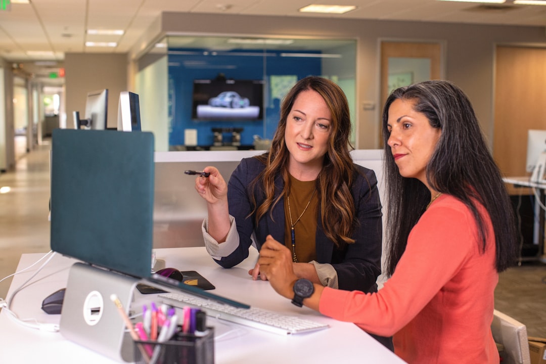 Women leaders collaborating in a modern office meeting